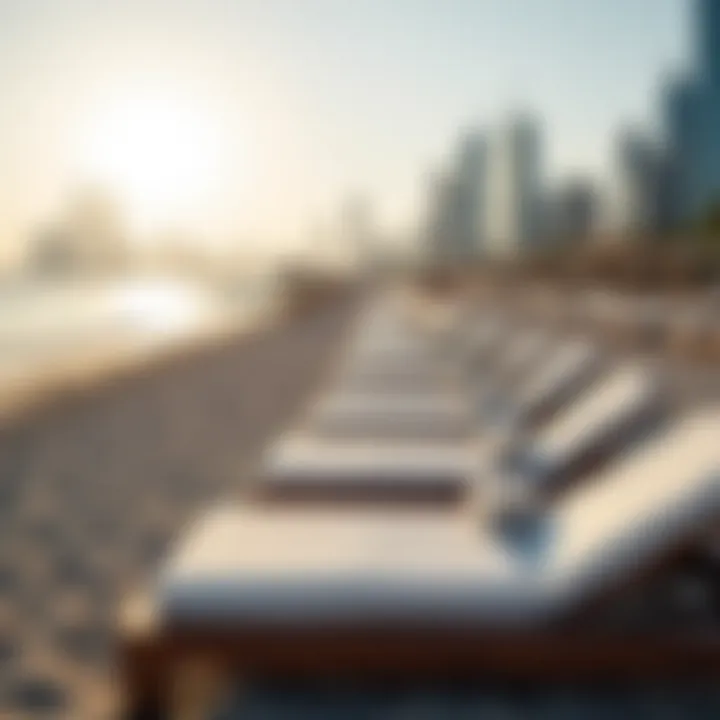 Sunbeds arranged on JBR beach with a view of the skyline